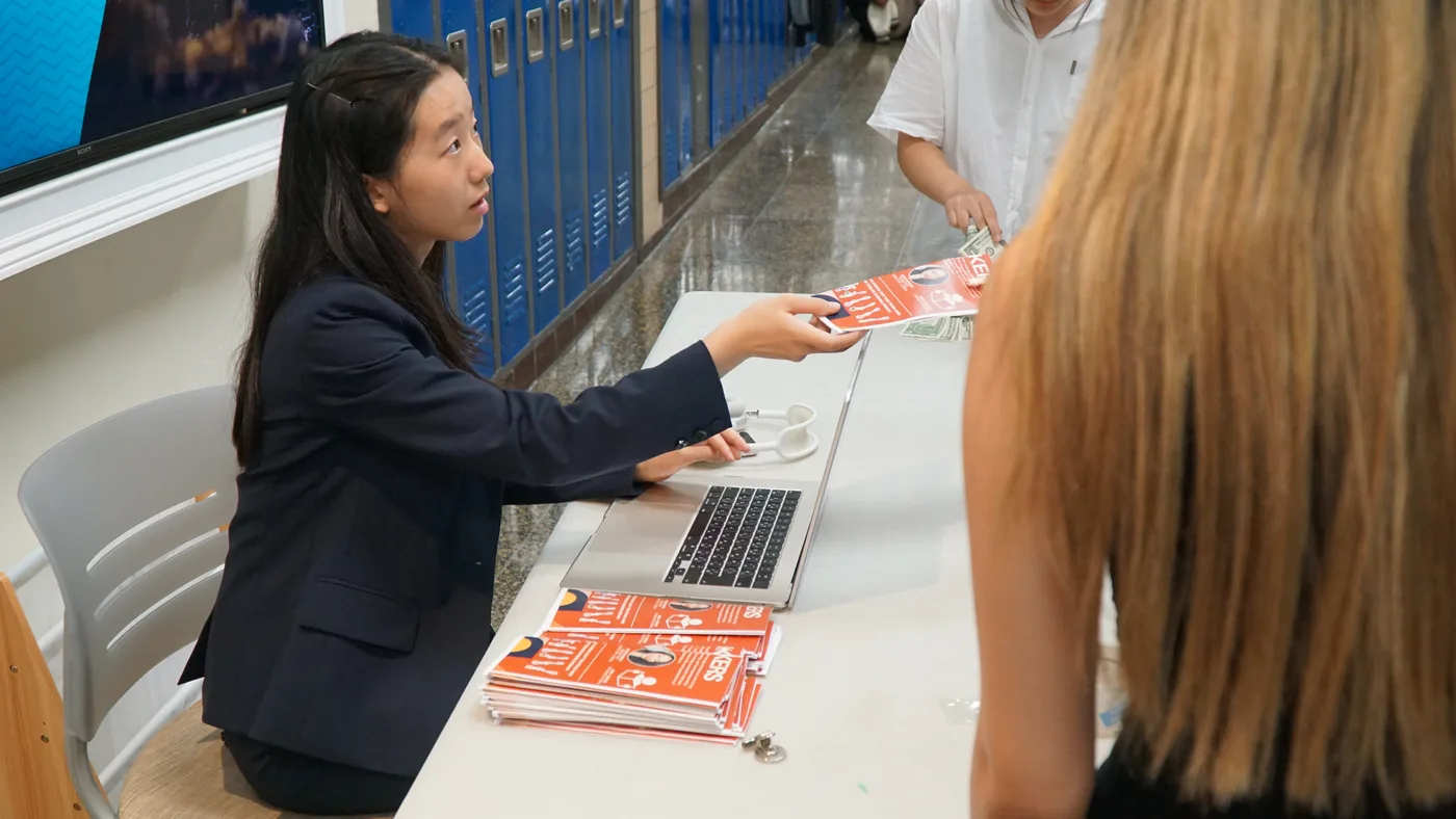 Check-in + brochures at the AIA Youth Workshop
